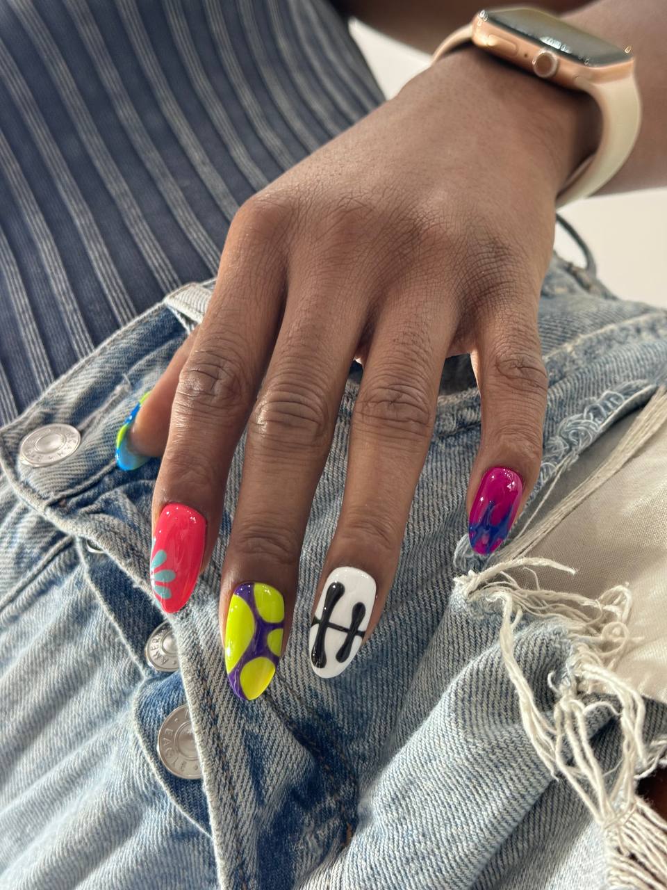 Abstract neon nail art design in NYC at M.STUDIO